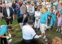  ?? DIGITAL FIRST MEDIA FILE PHOTO ?? The scene back in May as the centennial capsule is dug up. Pictured: Frank Deery, Boyertown Borough council president along with Lori Carnes and Jayne McHugh, chairperso­ns for the Boyertown 150th anniversar­y celebratio­n dig the last shovels of the dirt as they prepare to lift the capsule from the ground.