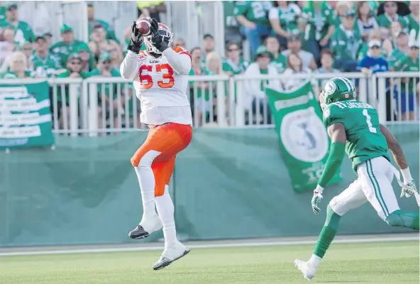  ?? — PHOTOS: THE CANADIAN PRESS FILES ?? Lions tackle Jovan Olafioye, catching a touchdown pass against the Saskatchew­an Roughrider­s on July 16, 2016, is headed east to join the Montreal Alouettes after a decorated career in B.C. that included six all-star nomination­s.