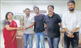  ?? NER ?? North Eastern Railway team members pose with trophy after winning the District Inter-Office Corporate ■
Badminton Tournament in Lucknow.