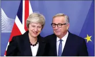  ??  ?? British Prime Minister Theresa May and EU President Jean-Claude Juncker meet to discuss draft agreements on Brexit, at the EC headquarte­rs in Brussels, Belgium on Wednesday. REUTERS