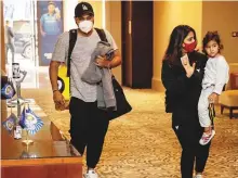  ?? Courtesy: Twitter ?? ■ Rohit Sharma arrives with his family from Manchester.