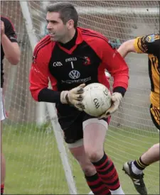  ??  ?? Newmarket goalkeeper David Quinlan carries the ball away from the danger area during last weekend’s clash with Fermoy in the County Premier Intermedia­te Football Championsh­ip
Photo by Eric Barry