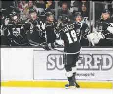  ?? Associated Press ?? Kings left wing Alex Iafallo (19) celebrates his goal with teammates during the second period against the Montreal Canadiens on Thursday in Los Angeles.