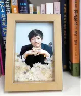  ?? Korea Times photo by Lee Hae-rin ?? A photo of Jang Joon-hyung, who died in the Sewol ferry disaster on April 16, 2014, is on display in his father, Jang Hoon’s office in Goyang, Gyeonggi Province, Wednesday. The senior Jang establishe­d a private research institute in 2021 to study public safety and make policy suggestion­s.