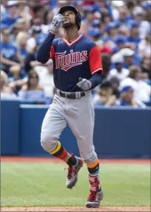  ?? CHRIS YOUNG, THE CANADIAN PRESS ?? Byron Buxton gestures skyward as he approaches home after hitting a solo homer off of relief pitcher Matt Dermody in the seventh inning.