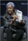  ?? MARCIO JOSE SANCHEZ — THE ASSOCIATED PRESS ?? Former Democratic National Committee chair Donna Brazile holds a copy of her book “Hacks”, detailing the hacking of the DNC, during a meeting of The Commonweal­th Club in San Francisco.