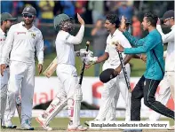  ??  ?? Bangladesh celebrate their victory