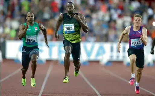  ?? AP ?? Usain Bolt from Jamaica (centre) competes with Yunier Perez from Cuba (left) and Jan Volko from Slovakia to win the 100 metres men’s event at the Golden Spike athletic meeting in Ostrava, Czech Republic. —