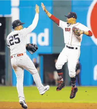  ?? Tony Dejak / Associated Press ?? The Yankees’ Gleyber Torres and Boston’s Mookie Betts celebrate the AL’s 43 victory.