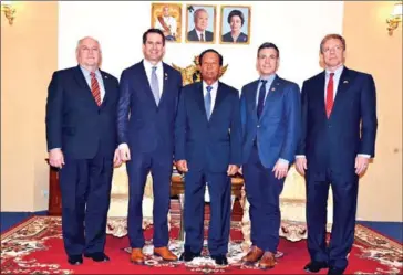  ?? SUPPLIED ?? (From left) Ron Estes, Seth Moulton, Tea Banh, Jim Banks and Patrick Murphy pose for a picture at the Council of Ministers’ Friendship Building on Wednesday.