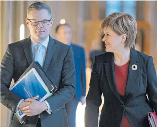  ?? Picture: Press Associatio­n. ?? Derek Mackay and Nicola Sturgeon will struggle to get the budget passed at Holyrood.