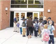  ?? KIM HAIRSTON/BALTIMORE SUN ?? Students and parents were treated to new air conditioni­ng at the renovated Frederick Elementary School for the first day of school in September 2017.