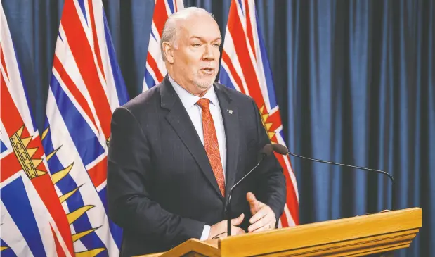  ?? DON CRAIG / B.C. GOVERNMENT ?? B.C. Premier John Horgan addresses the media Thursday where he floated the possibilit­y of restrictio­ns on travel to the province.