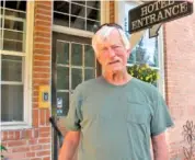  ?? AP PHOTO/NICHOLAS K. GERANIOS ?? Arlie Ward, owner of a hotel, discusses the effect of the closure of the nearby Pend Oreille Mine in downtown Metaline Falls, Wash. The mine closure will cost 200 good-paying jobs in the rural area.