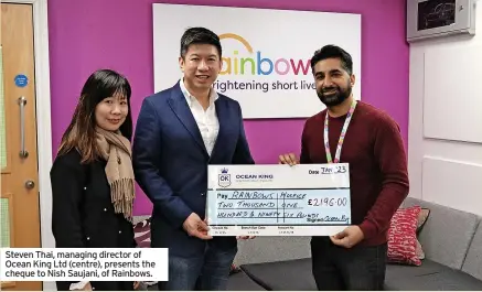  ?? ?? Steven Thai, managing director of Ocean King Ltd (centre), presents the cheque to Nish Saujani, of Rainbows.