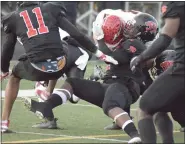  ?? GEORGE POHLY — THE MACOMB DAILY ?? Omarion Duncan of Michigan Collegiate tackles Clinton’s Brayden Randolph during the first quarter of a Division 6 regional championsh­ip game at Bishop Foley.