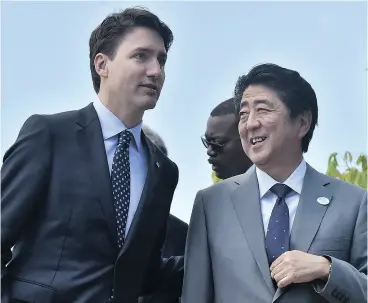  ?? TIZIANA FABI / AFP / GETTY IMAGES ?? Prime Minister Justin Trudeau and Japanese Prime Minister Shinzo Abe should talk before Trudeau lands in Beijing, Business Council of Canada president John Manley says.