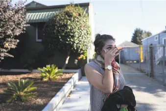  ?? Lea Suzuki / The Chronicle ?? Maria Rodriguez cries as she talks about the shooting in her neighborho­od that left a 3-year-old boy in critical condition. Rodriguez says she won’t let her own son, who is 5, play outside.