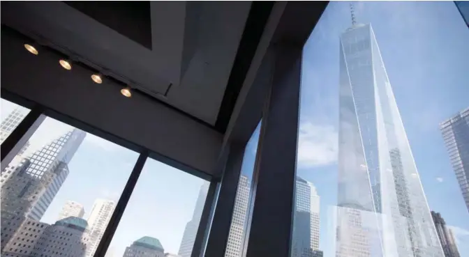  ??  ?? NEW YORK: Window seating in the Eataly restaurant offers a view of One World Trade Center (right) in New York. The Federal Reserve Bank of New York issued its Empire State manufactur­ing index for August. — AP