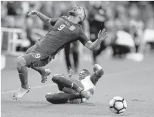  ?? SEAN M. HAFFEY/ GETTY IMAGES ?? Ever Alvarado of Honduras trips Sebastion Lletget (9) of the U.S. during their FIFA 2018 World Cup Qualifier at Avaya Stadium. Lletget, Brooks, Orozco and Morris were dropped by coach Arena, who added forward Arriola.