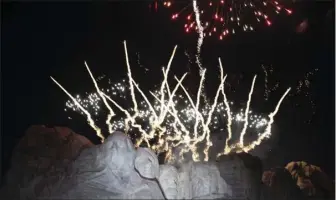  ?? AP PHOTO/ALEX BRANDON ?? In this July 3, 2020, file photo, fireworks light the sky over the Mount Rushmore National Memorial near Keystone, S.D. South Dakota Gov. Kristi Noem sued the U.S. Department of Interior on Friday in an effort to see fireworks shot over Mount Rushmore National Monument on Independen­ce Day. The Republican governor successful­ly pushed last year for a return of the pyrotechni­c display after a decade long hiatus.