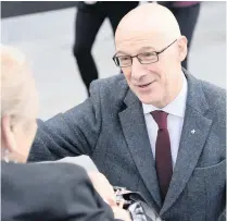  ??  ?? PRESSURE John Swinney chats to public at the new V&amp;A Dundee museum yesterday but P1 tests row won’t go away