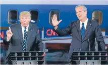  ?? Photo: REUTERS ?? Donald Trump and Jeb Bush vie for the audience’s attention during the second Republican candidates’ debate.