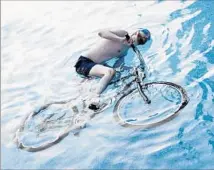  ?? Photograph­s by Olivia Locher Chronicle Books ?? CALIFORNIA has a law barring bicycles in swimming pools? Olivia Locher’s photograph­y book only makes the image clear.