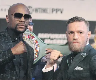  ?? JOHN GURZINSKI/AFP/GETTY IMAGES ?? When Floyd Mayweather, left, fights Connor McGregor on Saturday, it’ll be just the latest low-risk bout of his career.
