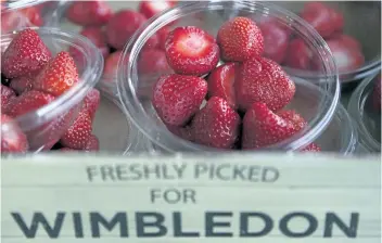  ?? TIM IRELAND/THE ASSOCIATED PRESS ?? Strawberri­es are seen on display Friday at the Wimbledon Tennis Championsh­ips in London.