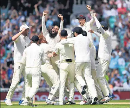  ??  ?? Triple threat: England’s Moeen Ali celebrates with teammates after his hat trick granted England victory during the third Investec Test between England and South Africa on July 31 in London. Photo: Mike Hewitt/Getty Images