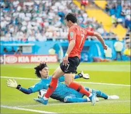  ?? Clive Mason Getty Images ?? MEXICO’S GUILLERMO OCHOA makes a save on Son Heung-Min of South Korea during the World Cup Group F match at Rostov Arena on Saturday.