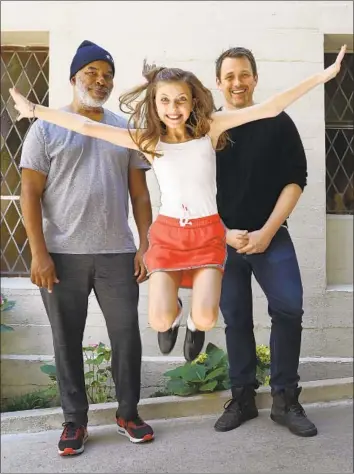  ?? Mel Melcon Los Angeles Times ?? DAVID ALAN GRIER, left, and Kaylin Hedges, with director Michael Arden, costar in “Annie” at Bowl.