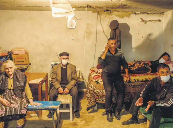  ?? P AF ?? People take shelter in the basement of a building in Azerbaijan’s Tartar as they escape Armenian shelling during an ongoing military conflict over the Armenia-occupied Nagorno-Karabakh, Azerbaijan, on Oct. 13, 2020.