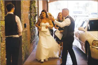  ?? YASMINA CHAVEZ (2018) ?? A bride and her entourage arrive at Vegas Weddings. In Nevada, Gov. Steve Sisolak recently raised the number of people allowed at gatherings such as weddings to 100 people or to 35% of venue capacity, whichever number is lower. If COVID-19 trends continue to decline, beginning March 15, those numbers will increase to 250 people or 50% capacity, whichever number is lower.