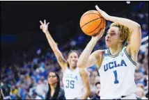  ?? ?? UCLA guard Kiki Rice (1) attempts a 3-point basket as guard Camryn Brown (35) gestures during the second half of the team’s first-round college basketball game against California Baptist in the women’s NCAA Tournament, Saturday, March 23, 2024, in Los Angeles. (AP)