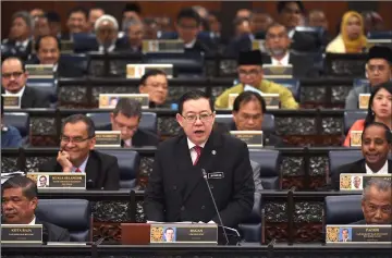  ??  ?? File photo shows Minister of Finance Lim Guan Eng tabling the 2019 Budget in the Dewan Rakyat. — Bernama photo