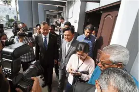  ??  ?? Day in court: Yong leaving the court in Ipoh after the mention of his rape case.