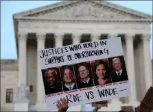  ?? GETTY IMAGES ?? GETTING ANGRY: A pro-choice activist holds up a sign during a rally last week in Washington, D.C., in front of the Supreme Court in response to the leaked Supreme Court draft decision to overturn Roe v. Wade.