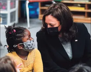  ?? Susan Walsh / Associated Press ?? Vice President Kamala Harris speaks to Galya Nkwenti, 5, in a classroom at the West Haven Child Developmen­t Center in West Haven on Friday.