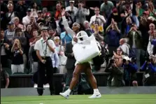  ?? Clive Brunskill / Getty Images ?? Serena Williams waves to the crowd after losing against Harmony Tan of France during their first-round singles match on day two of The Championsh­ips Wimbledon at the All England Lawn Tennis and Croquet Club on Tuesday.