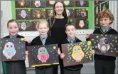  ??  ?? Teacher Fiona Ní Ghairbhí with Third Class pupils Sorcha, Sandra, Naoise agus Conchúr showing some of the beautiful Art work the class has done.