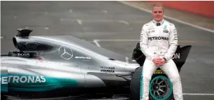  ?? AFP ?? Valtteri Bottas sitting on the new 2017 season Mercedes. —