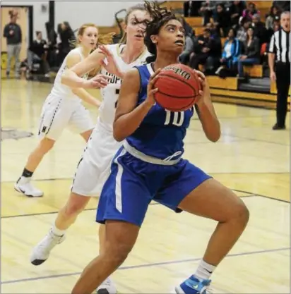  ?? GREGG SLABODA — TRENTONIAN PHOTO ?? Ewing’s Mya Grimes eyes the basket during a game against Hopewell Valley. Grimes is closing in on the 1,000-point milestone.
