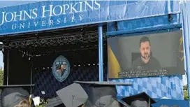  ?? WILL KIRK/JOHNS HOPKINS UNIVERSITY ?? Ukrainian President Volodymyr Zelenskyy speaks to the Johns Hopkins University Class of 2023 commenceme­nt.