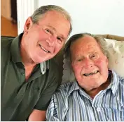  ?? Office of George W. Bush via AP ?? ■ Former U.S. presidents George H.W. Bush and his son George W. Bush pose Tuesday for a photo in Kennebunkp­ort, Maine.