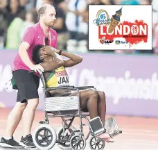  ?? RICARDO MAKYN/MULTIMEDIA PHOTO EDITOR ?? Anneisha McLaughlin-Whilby in tears while being helped from the track in a wheelchair after going down injured during the women’s 4x400m final at the IAAF World Championsh­ip in London, England, yesterday.