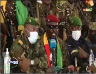  ??  ?? Junta leader Col. Mamady Doumbouya (center) addresses officials Monday in Conakry, Guinea.
(AP/Radio Television Guineenne)