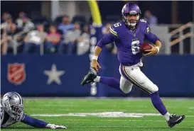  ?? Tom Pennington / Getty Images ?? A purple-clad Taylor Heinicke scrambles during a preseason stint with the Vikings. But now he’s studying the Texans’ playbook as the potential backup QB.