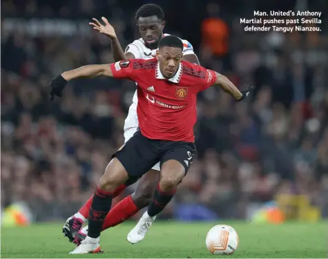  ?? ?? Man. United’s Anthony Martial pushes past Sevilla defender Tanguy Nianzou.